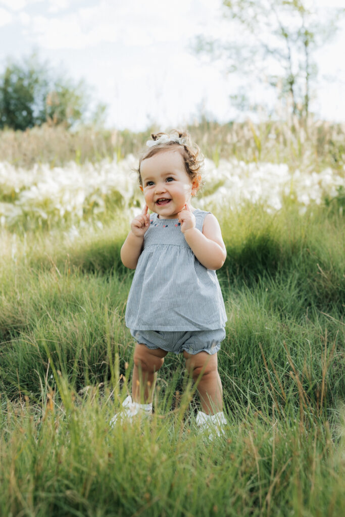 Cute little girl posing for family pictures at the Bountiful Pond.